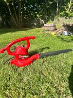 Full view of Toro Ultra Blower Vac lying on grass