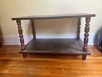 Front view showing two-tier structure and spindle legs