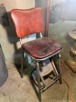 Front angle view showing chair and folded steps