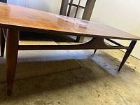 Side view showing legs, stretcher base, height