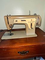 Singer Model 237 sewing machine mounted in cabinet
