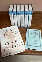 Front view of six Oxford Illustrated Jane Austen volumes plus two additional biographies on tabletop