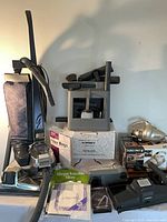 Kirby upright, attachment caddy, Shark hand vac, Kirby boxes and accessories