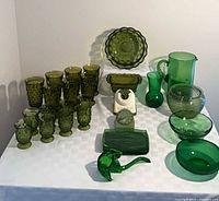 Full lot showing green glassware, scale, timer