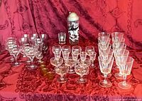 Full lot showing martini shaker, shot glass, amber shots, coupes, wine glasses, dessert/liqueur glasses