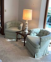 Two mint Drexel barrel chairs, wood glass bamboo table, white ceramic lamp