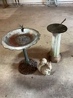 birdbath, sundial and squirrel grouped