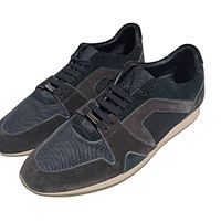 Top angled view of both sneakers showing uppers and laces