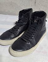 Full view of both sneakers from front-side angle