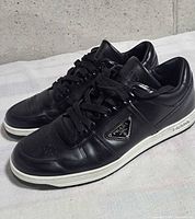 Overall view of both sneakers showing uppers and laces