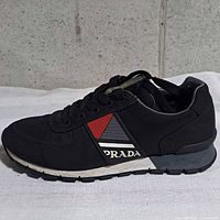 Side view of right shoe showing overall design, branding and condition