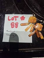 Earrings on note showing lot number