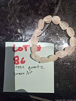 Full view of rose quartz bracelet on surface