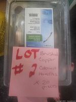 Sealed package showing brushed copper pull handle and product label