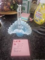 Full view of blue opalescent hobnail blown glass basket with handle