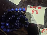 Coiled lapis lazuli bead necklace with lot note visible