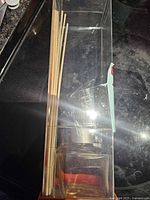 Full view of boxed reed diffuser showing reeds and bottle