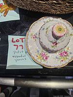 stacked bread plate, saucer and lid showing pattern