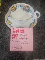 teacup on saucer with lot note