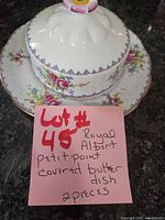 Covered butter dish with lid on plate showing overall item