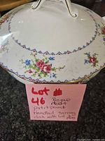 Covered dish with lid showing pattern and lot note