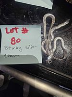 Coiled sterling snake chain with clasp visible