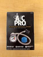 Front of boxed A/C Pro R-134a Professional Gauge kit