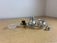 Front view of five shaker parts aligned