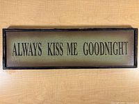 Front view of wooden sign showing text and crackle finish