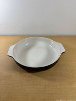 Top view of round baking dish showing interior and handles