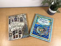 Front covers of both hardcover books on tabletop