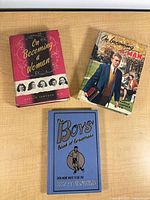 Front covers of the three hardcover books