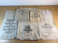 Front view of all five printed coin bags