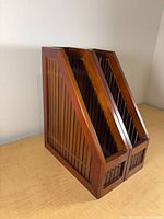 Pair of wooden slatted drawers sides showing slanted profile and slat construction