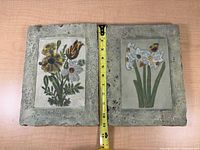 Front view of both plaques with measuring tape showing size