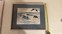 Front view showing watercolor seascape, mat, frame, tape measure for size reference