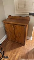 Front view of pine dry sink cabinet with doors closed
