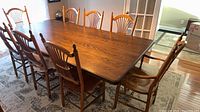 Dining table with eight Windsor-back chairs