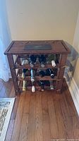 Front view showing full wine rack with three tiers and slate-inlay top