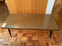 Full view of rectangular coffee table on parquet floor
