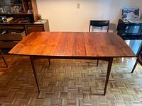 Full view of table front, leaf in place