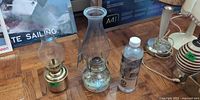 Both oil lamps and lamp oil bottle overview
