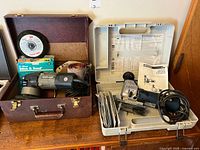 Porter-Cable sander case and Bosch jigsaw case open showing tools and accessories