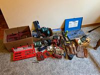 Overall view of all tool sets, drill, tap & die case and accessories on floor