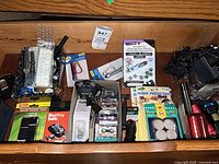 Drawer view with packaged hardware, microcassettes, flashlights, floor protectors