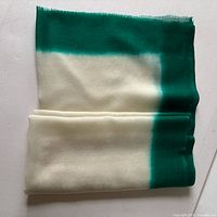 Folded ivory and green dip-dyed wool scarf