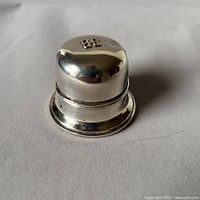 Front and top view showing Birks silver plate ring box and reflective finish