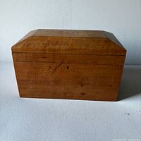 Closed burl maple box front view showing dovetail corners and grain