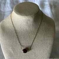 Full view of necklace on display form