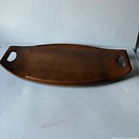 Top view of oval wood tray with handles